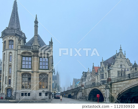 Ghent, Belgium. Old historic building near the river Leie on a foggy autumn day. 112030910