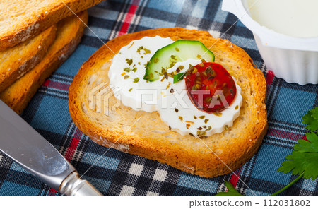 Apetizing canape with young white cheese Apetizing canape with young white cheese 112031802