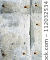 Old weathered concrete wall texture with rusty screws 112032534