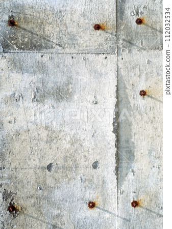 Old weathered concrete wall texture with rusty screws 112032534