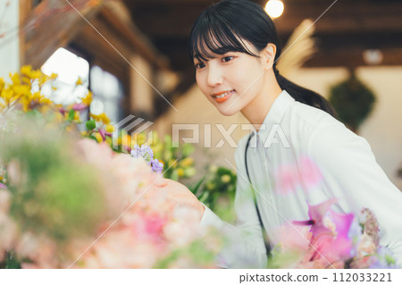 A female customer at a flower shop A female customer at a flower shop 112033221