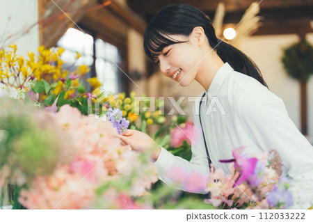 A female customer at a flower shop A female customer at a flower shop 112033222
