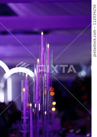 Elegant chandelier in a draped ceiling banquet hall. Elegant chandelier in a draped ceiling banquet hall. 112034256