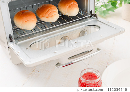 Butter rolls baked in a toaster oven Butter rolls baked in a toaster oven 112034346