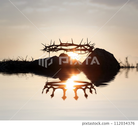 The crown of thorns symbolizing the suffering and trials of Jesus Christ and the crown of heaven reflected in the water, Passion Week and Easter background 112034376