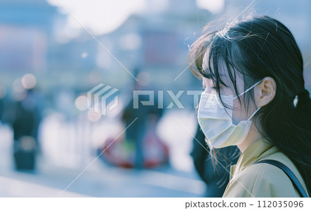 Asian woman wearing a mask Asian woman wearing a mask 112035096