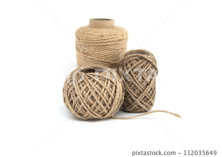 Spools of jute twine isolated on white background 112035649