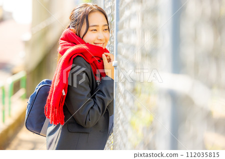 High school girl waiting for her boyfriend outside High school girl waiting for her boyfriend outside 112035815