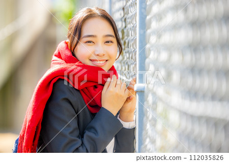 High school girl waiting for her boyfriend outside 112035826