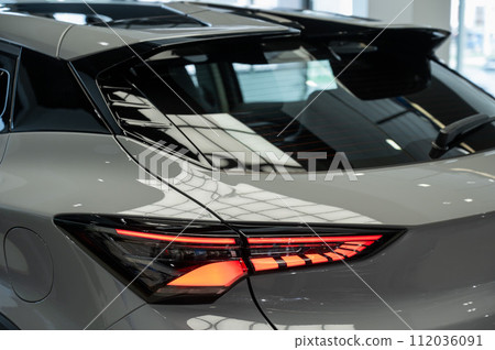 Close-up of the taillight of a white modern car. Close-up of the taillight of a white modern car. 112036091