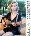 [AI image] Gravure of a beautiful woman playing the guitar with a smile 112037597