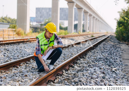Engineer railway tracks construction service team working on site survey checking and maintenance inspection train track for safety 112039325