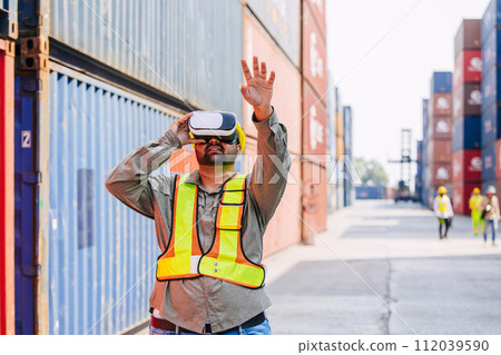 Worker Using VR Vision Pro Technology Equipment Headset Device Work at Container Yard Construction site Innovation in Logistics Industry Worker Using VR Vision Pro Technology Equipment Headset Device Work at Container Yard Construction site Innovation in Logistics Industry 112039590