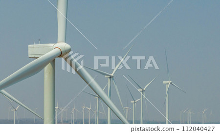 Wind farm or wind park, with high wind turbines for generation electricity, Green ecological power energy generation, Wind farm eco field. Wind farm or wind park, with high wind turbines for generation electricity, Green ecological power energy generation, Wind farm eco field. 112040427