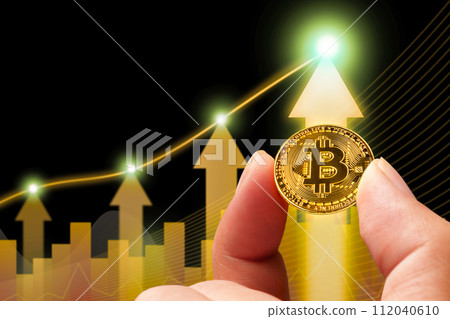 Bitcoin or cryptocurrency prices rise up positive, golden coin holding in a hand with up arrow chart 112040610