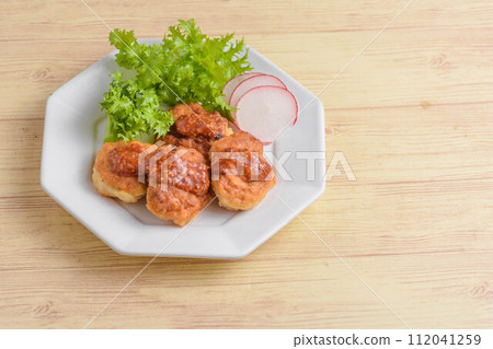 Handmade chicken nuggets with ketchup mustard sauce 112041259
