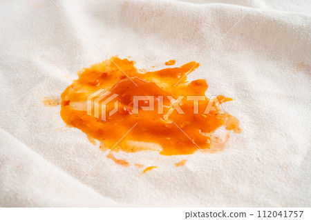 Dirty tomato sauce stain or ketchup on cloth to wash with washing powder, cleaning housework. 112041757