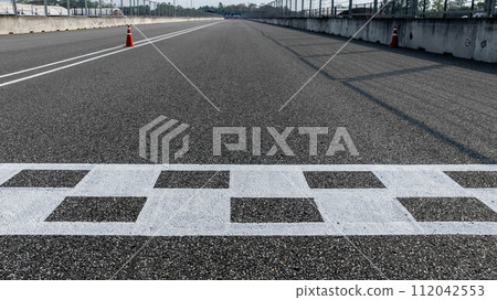 Aerial view abstract asphalt black Start and Finish grid line for race car in circuit texture background, Automobile and automotive background. Aerial view abstract asphalt black Start and Finish grid line for race car in circuit texture background, Automobile and automotive background. 112042553