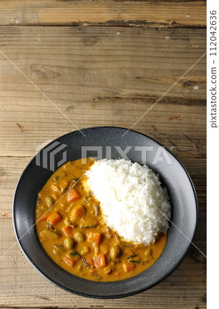 Curry rice with plenty of vegetables such as pork, pumpkin, and carrots. Curry rice with plenty of vegetables such as pork, pumpkin, and carrots. 112042636