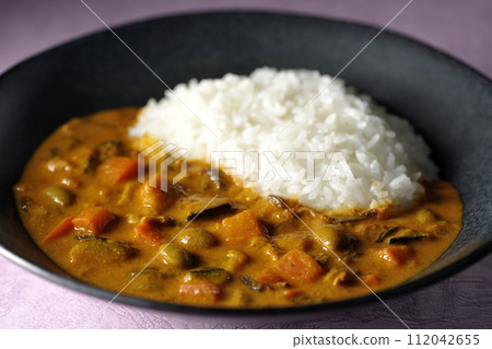 Curry rice with plenty of vegetables such as pork, pumpkin, and carrots. Curry rice with plenty of vegetables such as pork, pumpkin, and carrots. 112042655