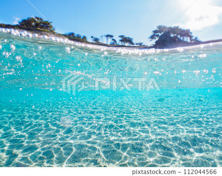 A beautiful half-water shot of the sea at Tomari Beach on Shikine Island. At Tomari Beach, Shikinejima, Izu Islands, Tokyo. November 2023 A beautiful half-water shot of the sea at Tomari Beach on Shikine Island. At Tomari Beach, Shikinejima, Izu Islands, Tokyo. November 2023 112044566
