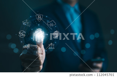 Cybersecurity concept. Businessman using thumb to scan fingerprint or for digital processing biometric identification to access security system including Internet banking, Cloud computing, Big data, 112045701