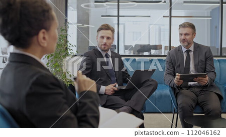 Three company employees sharing ideas at office meeting, business development Three company employees sharing ideas at office meeting, business development 112046162