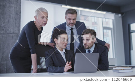Colleagues discussing business project in office, team of professionals gathered in conference room Colleagues discussing business project in office, team of professionals gathered in conference room 112046669