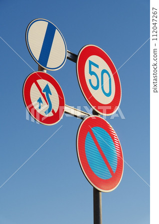 Road sign: Maximum speed, No parking, Extends right side for overtaking, No passing allowed End Road sign: Maximum speed, No parking, Extends right side for overtaking, No passing allowed End 112047267
