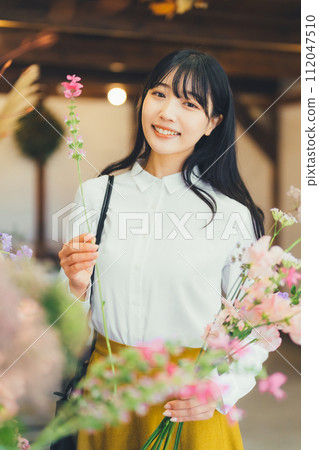 A female customer at a flower shop A female customer at a flower shop 112047510