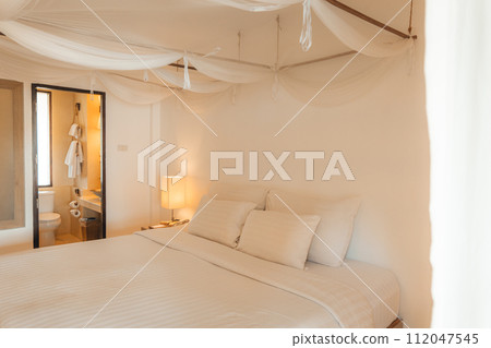 Modern Cozy Bedroom In Pastel Tones 112047545