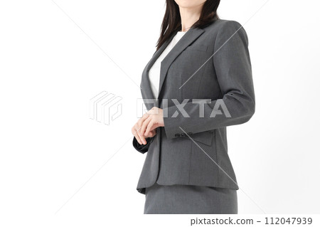 Middle-aged woman in a suit (no face) Middle-aged woman in a suit (no face) 112047939