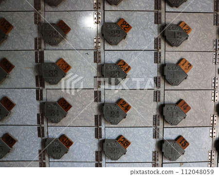 Shoe rack in a nostalgic public bath 112048059