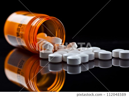 Oxycodone, Opioid prescription pills spilled onto a table. Addiction prescription pain killer tablets. Ai Generative image 112048389