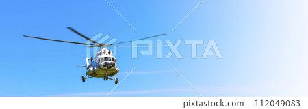 Helicopter in the sky at approach on sunlight Helicopter in the sky at approach on sunlight 112049083