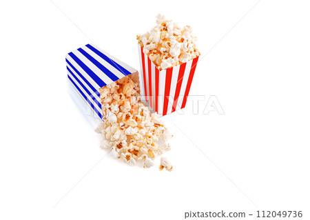 Glass with popcorn on a white background Glass with popcorn on a white background 112049736