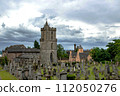View on old church and cemetery in Stirling, Scotland, Great Britain under the dark sky. 112050276