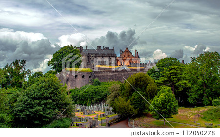 View on old church and cemetery in Stirling, Scotland, Great Britain under the dark sky. 112050278