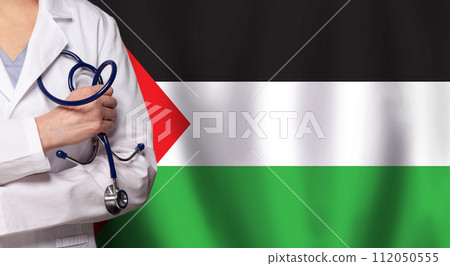Palestine medicine and healthcare concept. Doctor close up against flag of Palestina background 112050555