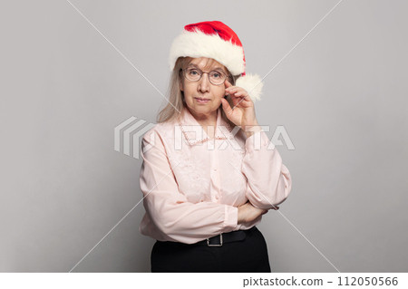 Grandma in Santa hat, Christmas portrait Grandma in Santa hat, Christmas portrait 112050566