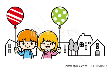 Smiling children with balloons standing in a residential area 112050814