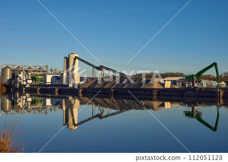 Riverside Manufacturing Twilight. Environmental Technology and Production. Riverside Manufacturing Hub. Eco-Friendly Technology and Production. industry and the environment, showcasing the integration 112051128