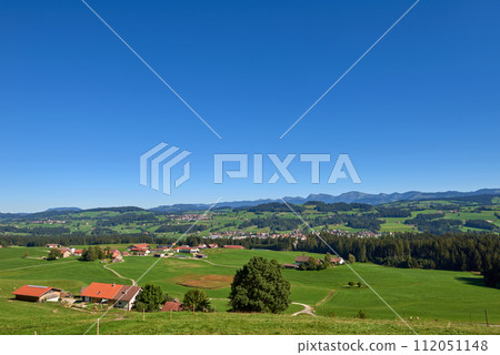 Alpine Foothills Charm: Rural Mountainside Living with Farmer's Homesteads. Mountain Countryside: Farmer's Dwellings, Pastures, and the Sky Above. Nature's Eco-Friendly Living in the Alpine Highlands Alpine Foothills Charm: Rural Mountainside Living with Farmer's Homesteads. Mountain Countryside: Farmer's Dwellings, Pastures, and the Sky Above. Nature's Eco-Friendly Living in the Alpine Highlands 112051148