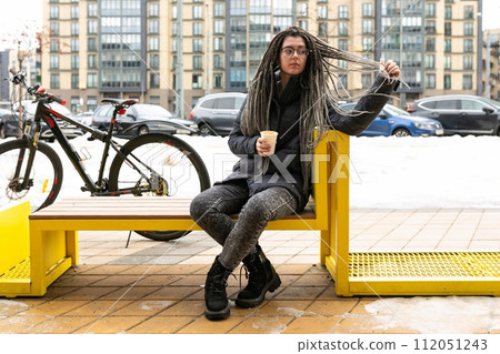 Urban pretty woman with bicycle in winter Urban pretty woman with bicycle in winter 112051243