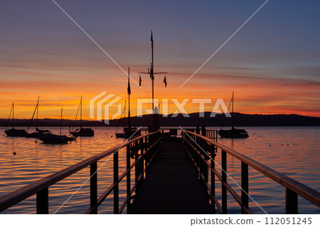 Bodensee Lake Sunrise Panorama. Morning Sunlight Over Tranquil Waters. 112051245