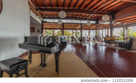 Panorama showing Interior of a modern hotel cafe bar restaurant with piano and fireplace timelapse Panorama showing Interior of a modern hotel cafe bar restaurant with piano and fireplace timelapse 112052209