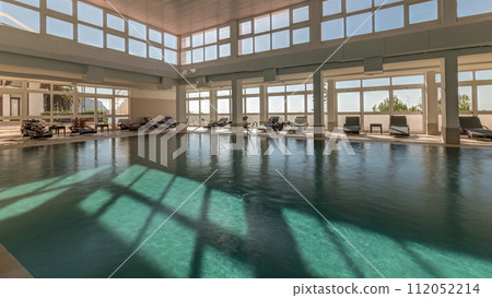 Panorama showing luxury indoor swimming pool, part of hotel timelapse 112052214