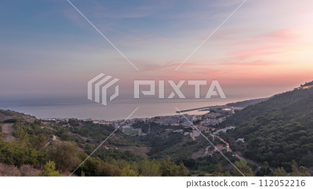Panorama showing aerial view of Sesimbra Town and Port day to night timelapse, Portugal. 112052216