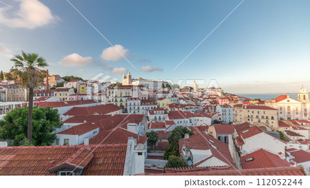 Panorama showing aerial view of Alfama in Lisbon timelapse during sunset. 112052244