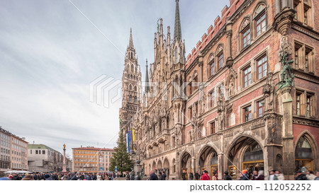 Main facade of the New Town Hall building at the northern part of Marienplatz day to night transition in Munich, Germany. Main facade of the New Town Hall building at the northern part of Marienplatz day to night transition in Munich, Germany. 112052252